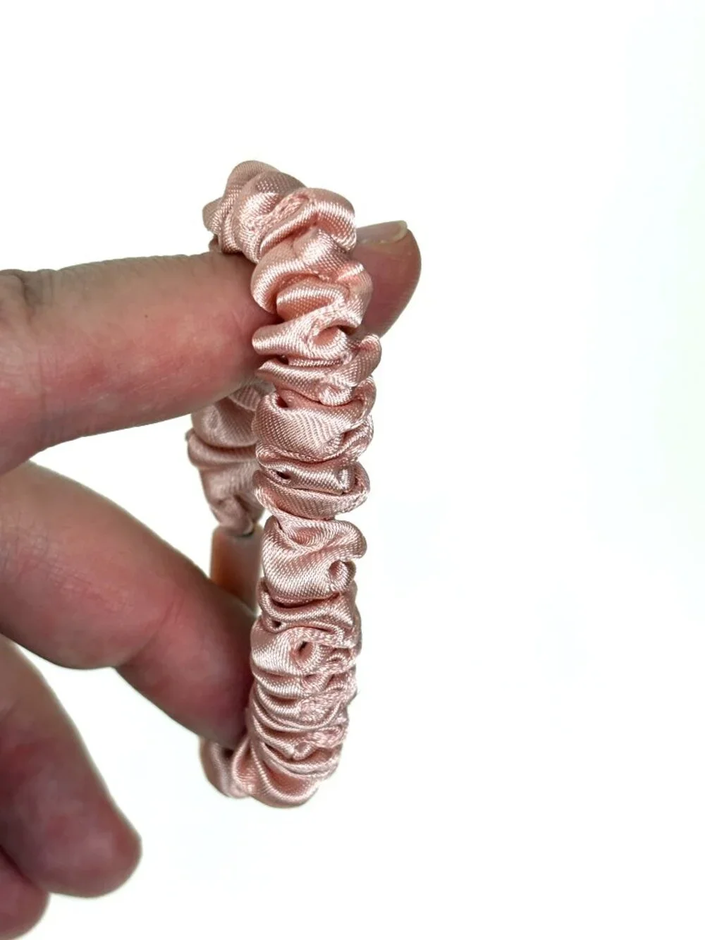Skinny satin hair scrunchie / skinny hair tie in a light pink / blush shade. New